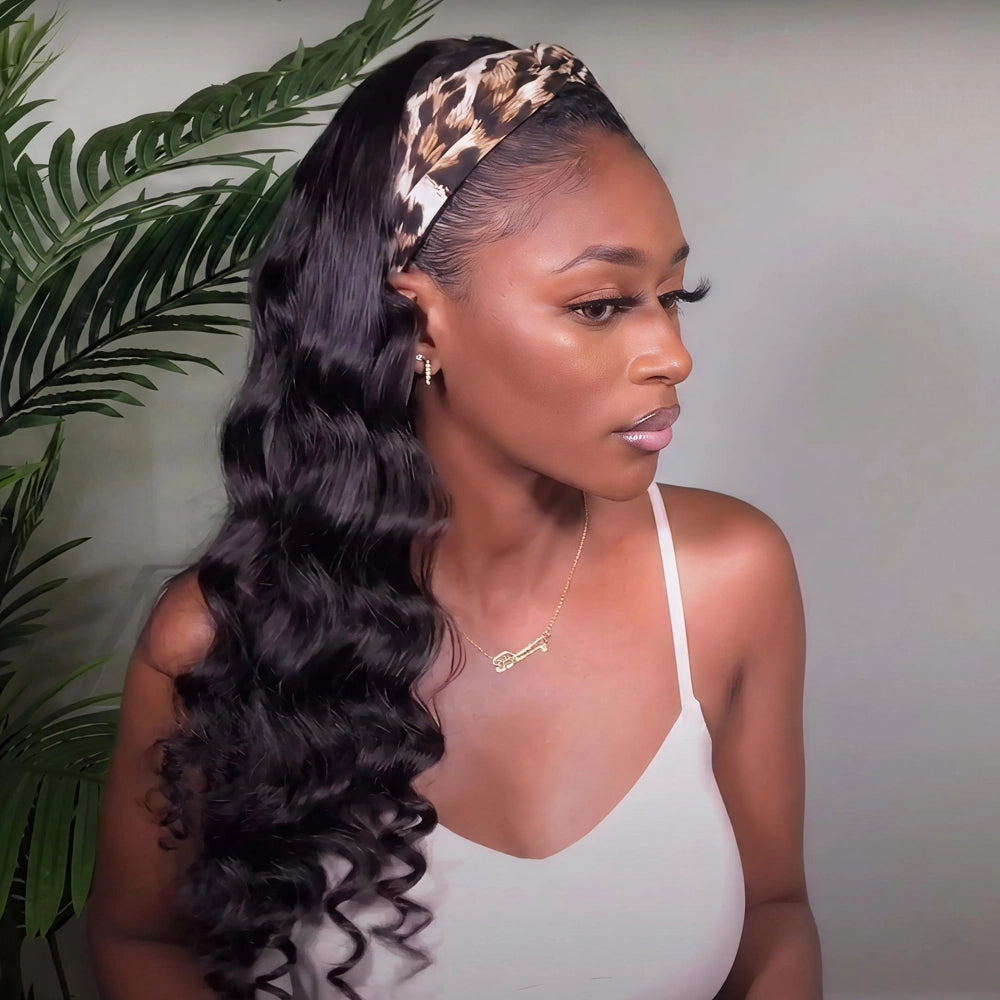 Mimicing Body Wave headband glueless virgin hair wig styled with a leopard print headband, featuring a profile view of a woman to highlight the long, soft wavy texture and effortless look.