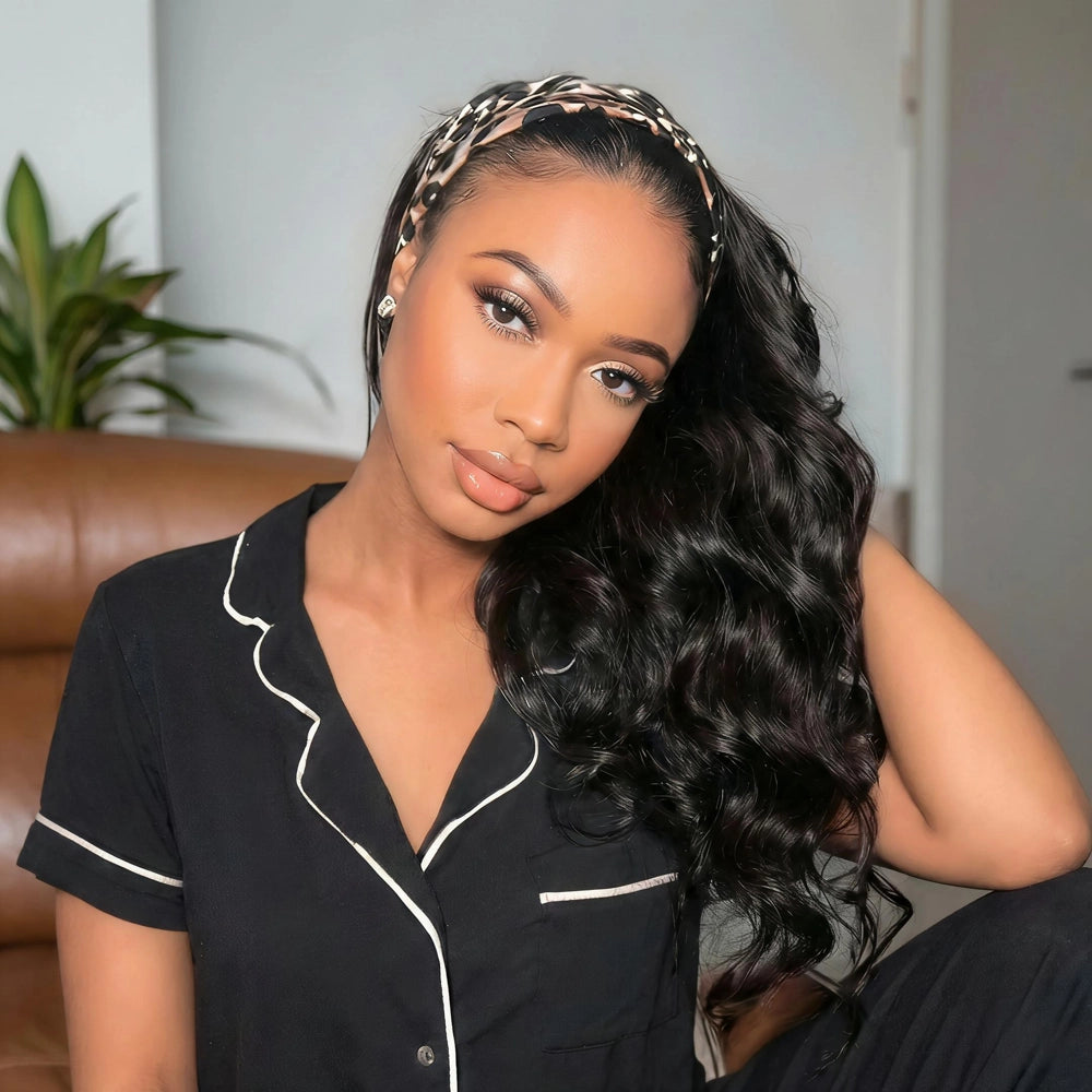 Mimicing Body Wave headband glueless virgin hair wig styled with a patterned headband, featuring a woman in a black pajama-style top with white trim, showcasing a relaxed and elegant indoor home look.