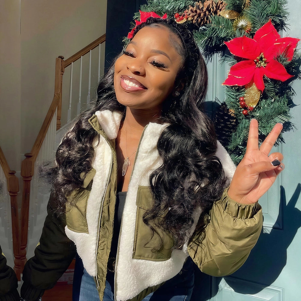 Mimicing Body Wave headband glueless virgin hair wig styled for a festive holiday look, featuring a smiling woman in front of a Christmas wreath with a red poinsettia.