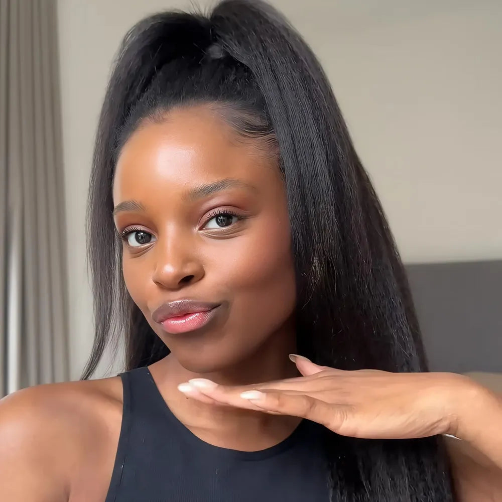 Young woman wearing a long Mimicing kinky straight headband wig styled in a high half-up ponytail.