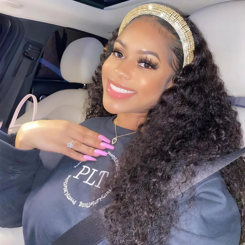 Mimicing Water Wave headband glueless wig made from virgin hair, styled with a glamorous gold headband in a car setting, showcasing a voluminous and natural curly look.